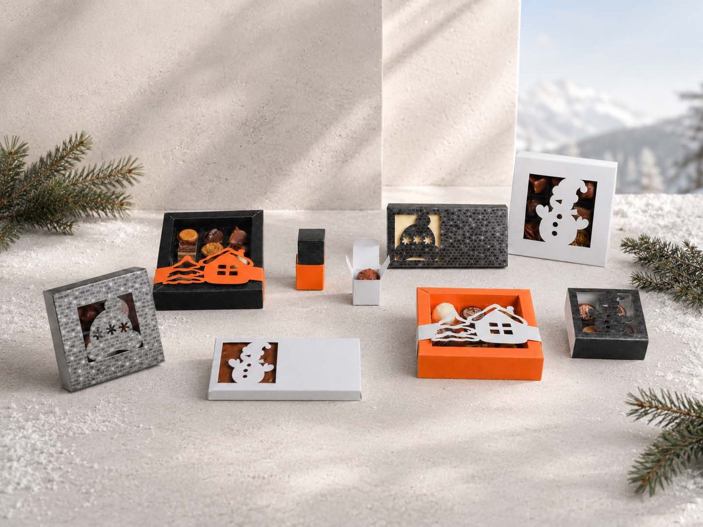 Kollektion Bommelmütze und Schneemann – Boxen in Orange, Grau und Schwarz